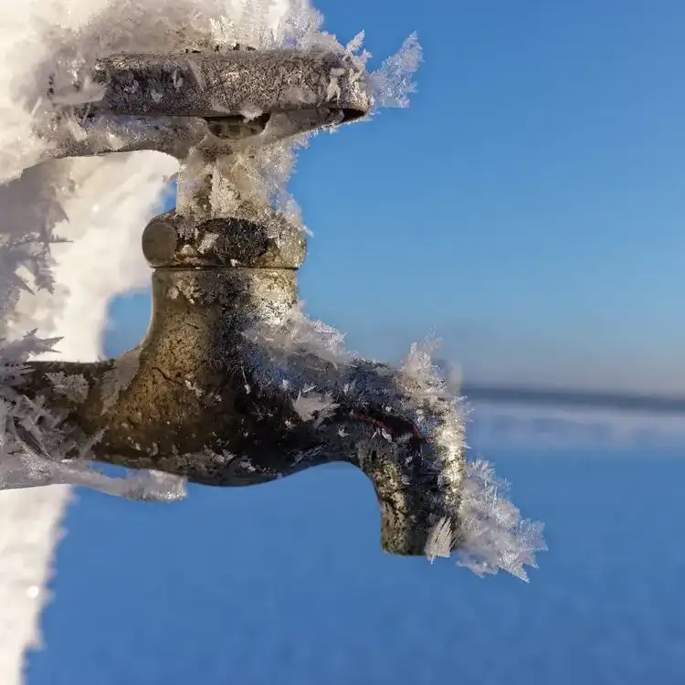 Outdoor spigot with ice on it